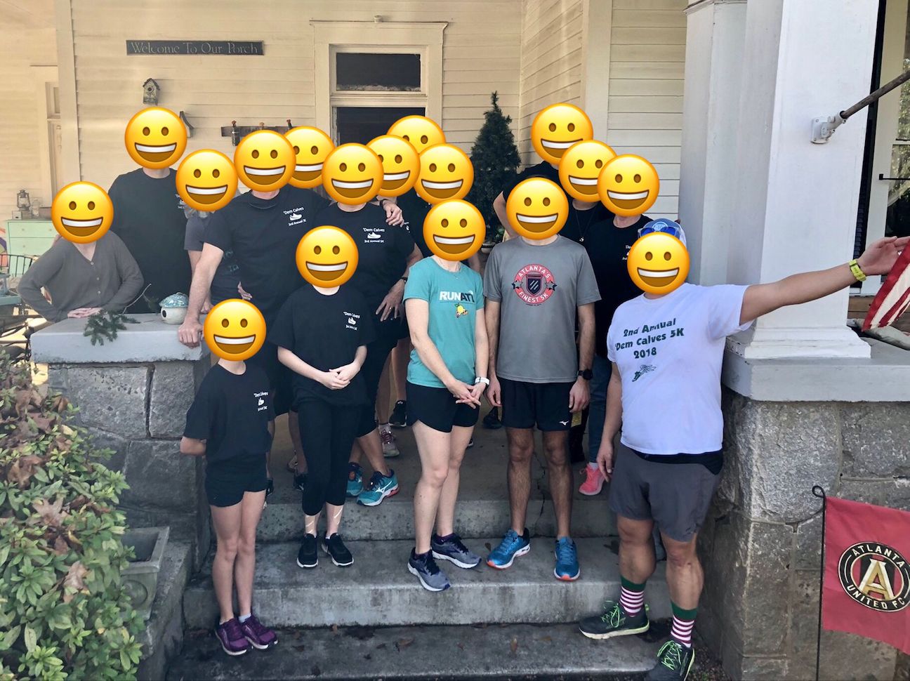 A group of sweaty people stand on the front porch of a house smiling and full of happy wishes for the birthday boy.