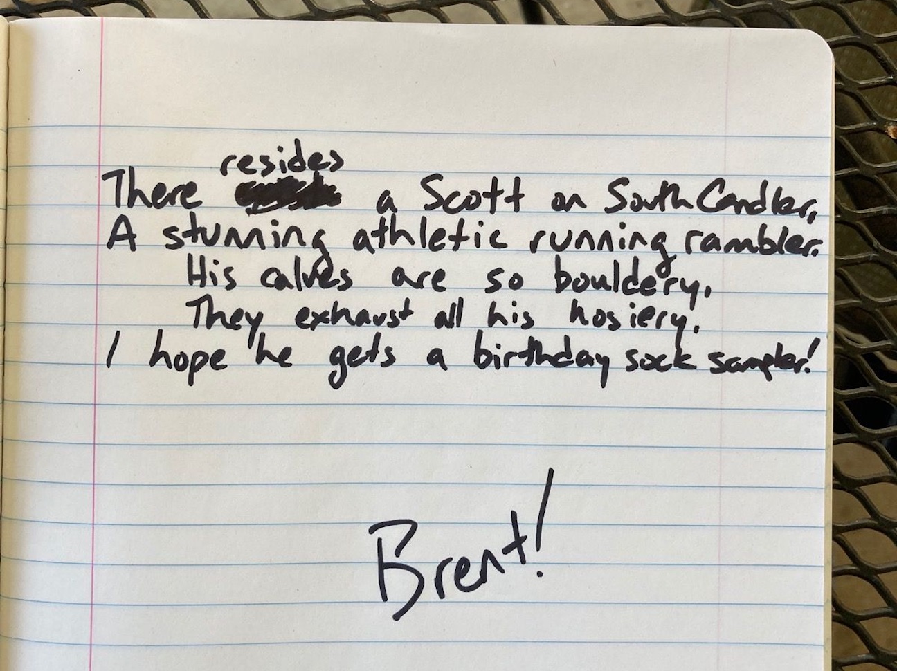 A handwritten poem that says: 'There resides a Scott on South Candler, / A stunning athletic running rambler. / His calvese are so bouldery, / They exhaust all his hosiery. / I hope he gets a birthday sock sampler! / / Brent!'